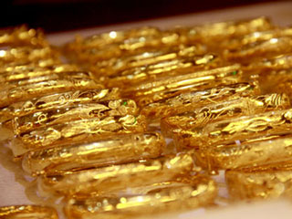 Giá vàng giảm, USD tăng